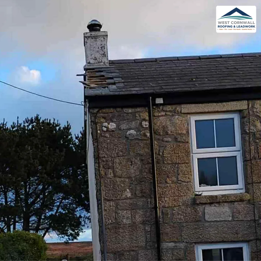 Storm damage, slipped slates at the chimney